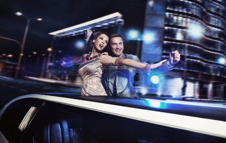 Smiling couple over night city background