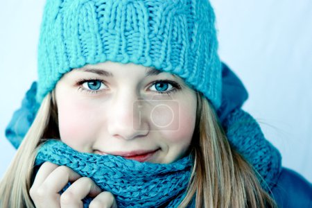 Beautiful girl in winter clothes