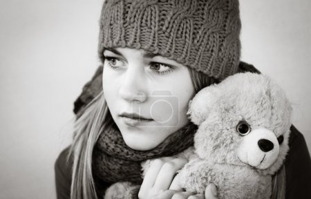 Girl with teddy bear