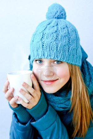 Girl with a cup of hot tea