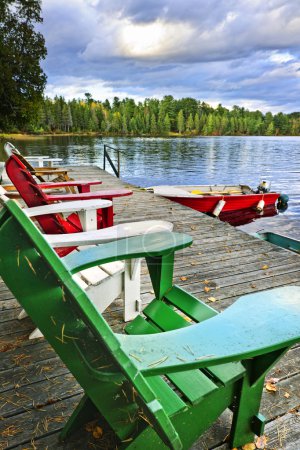 Deck chairs on dock at lake