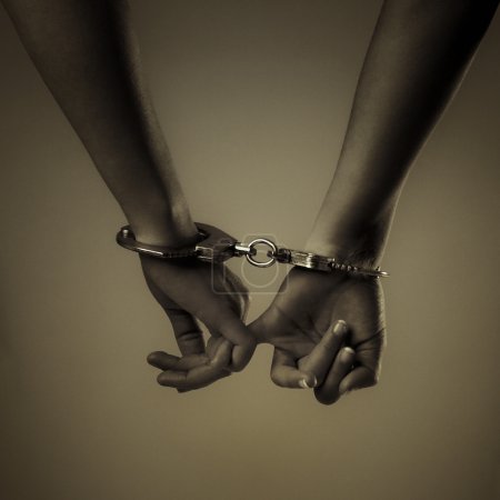 Two girl hand and handcuffs