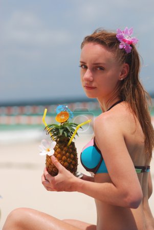 Girl with tropical cocktail