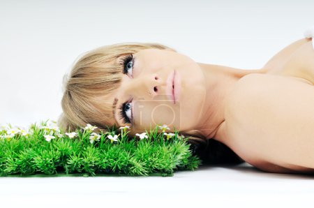 Woman face on grass