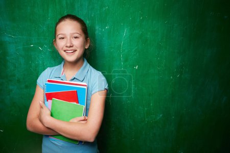Schoolgirl with textbooks
