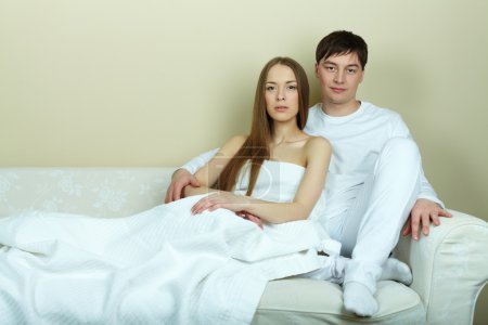 Woman and  husband having rest at home
