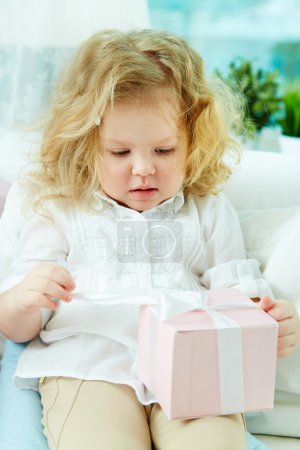 Girl unwrapping present