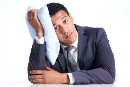 Businessman with pillow