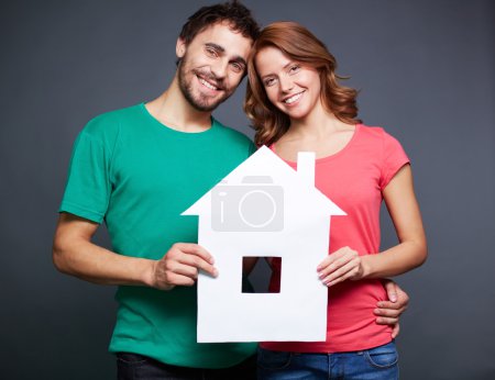 Couple with paper house