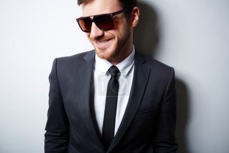 Businessman in suit and sunglasses