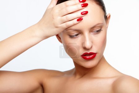 Woman with red lips and fingernails