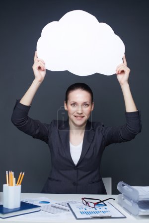 Businesswoman holding blank speech bubble