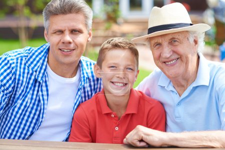 Boy with his grandfather and father