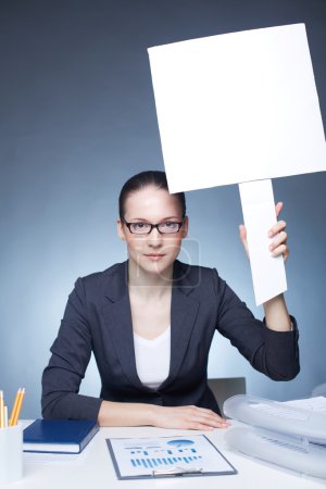Businesswoman with blank paper