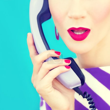 close-up portrait of a retro girl with telephone