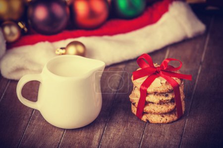 Cookies, earrings and christmas gifts at background