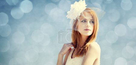 Young bride at blue sky background.