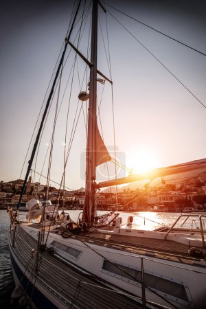 Luxury sailboat in sunset