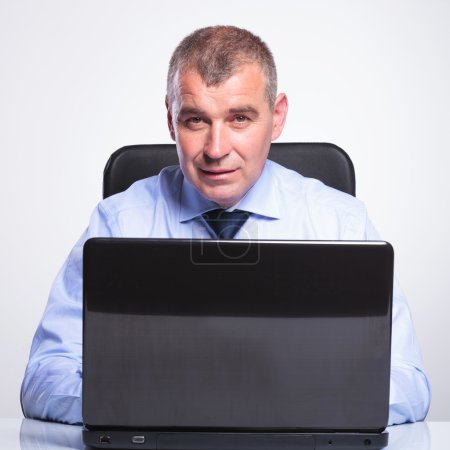 old business man working at laptop