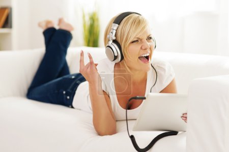 Woman listen to rock music at home