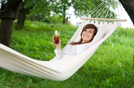 Woman resting on hammock