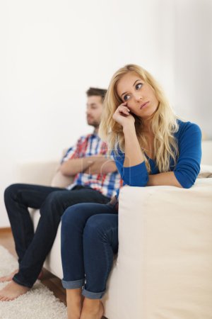 Crying woman sitting with her boyfriend