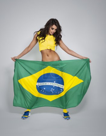 Woman supporting of brazilian soccer team