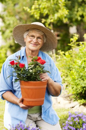 Senior woman with flowers