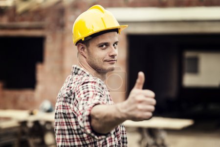 Construction worker gesturing thumbs up