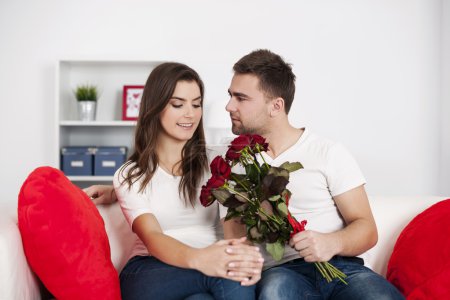 Loving couple with red roses