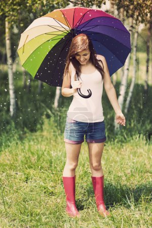 Woman in rainy summer day