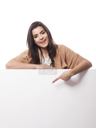 Woman pointing at whiteboard