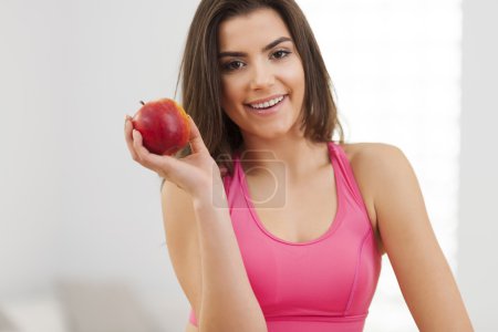 Fitness woman with apple