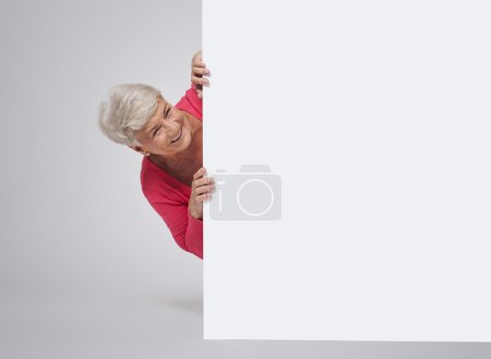 Senior woman behind the whiteboard