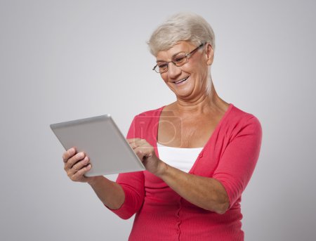 Senior woman using  digital tablet
