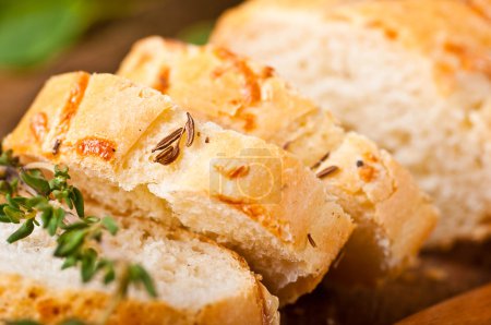 Fresh bread and butter on a wooden board