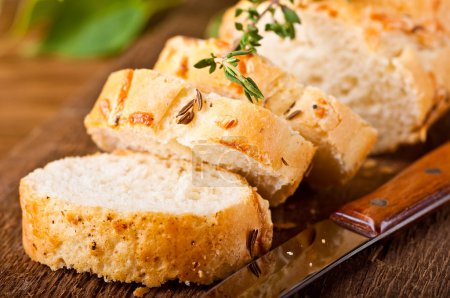 Fresh bread and butter on a wooden board