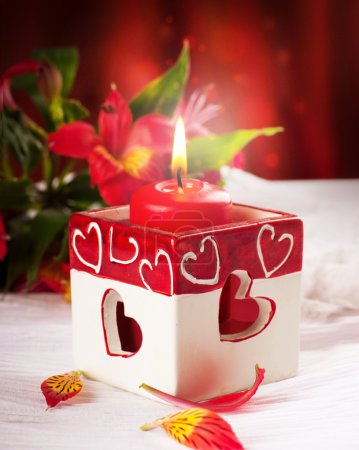 Red candle with heart and flower, a Valentine's Day card