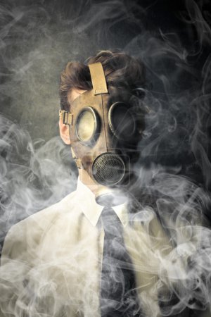Businessman with a gas mask