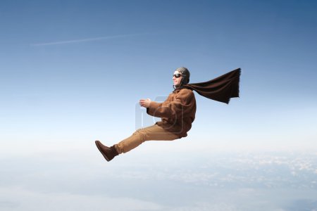 Man flying with pilot cloths