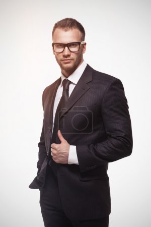 Businessmanman in black suit and glasses