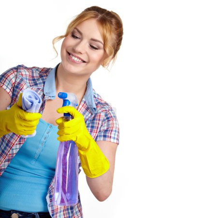 Spring cleaning woman pointing cleaning spray bottle.