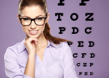 beautiful woman with trendy glasses on the background of eye te