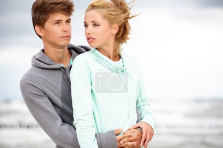 Romantic young couple on autumn beach