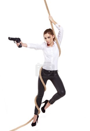 young beauty woman holding handgun, ready to fight