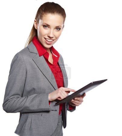 young attractive business woman uses a mobile tablet computer wi