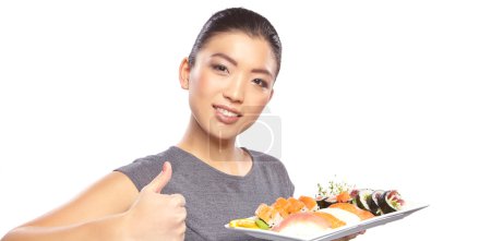Woman with a plate of sushi