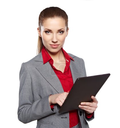 Young attractive business woman uses a mobile tablet computer