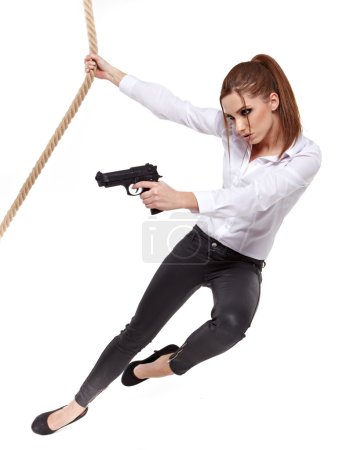 young beauty woman holding handgun, ready to fight