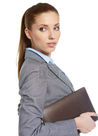 Young attractive business woman uses a mobile tablet computer